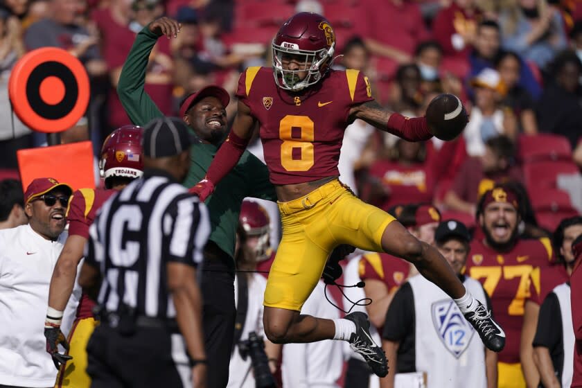 Southern California cornerback Chris Steele celebrates after intercepting a pass.