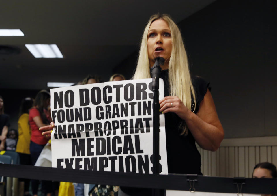 Tanya Collins joined hundreds of others calling on lawmakers to reject a measure by state Sen. Dr. Richard Pan, D-Sacramento, who is a pediatrician, that would give public health officials oversight of doctors that may be giving fraudulent medical expeditions from vaccinations during a hearing of the Assembly Health Committee at the Capitol in Sacramento, Calif., Thursday, June 20, 2019. (AP Photo/Rich Pedroncelli)