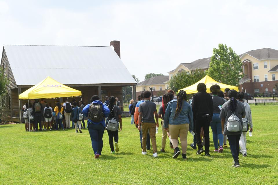 Participants in the Juneteenth Freedom Walk held Thursday at Louisiana State University of Alexandria walked from the main campus to the Edwin Epps House, a symbol of slavery, to lay a wreath in memorial to enslaved people.