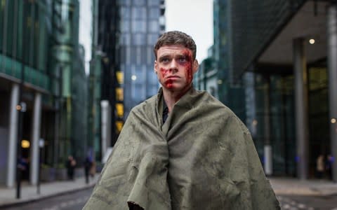 Richard Madden in character as David Budd, who looks concerned while covered in blood in first-look pictures from the finale of BBC One drama Bodyguard - Credit:  Sophie Mutevelian/PA