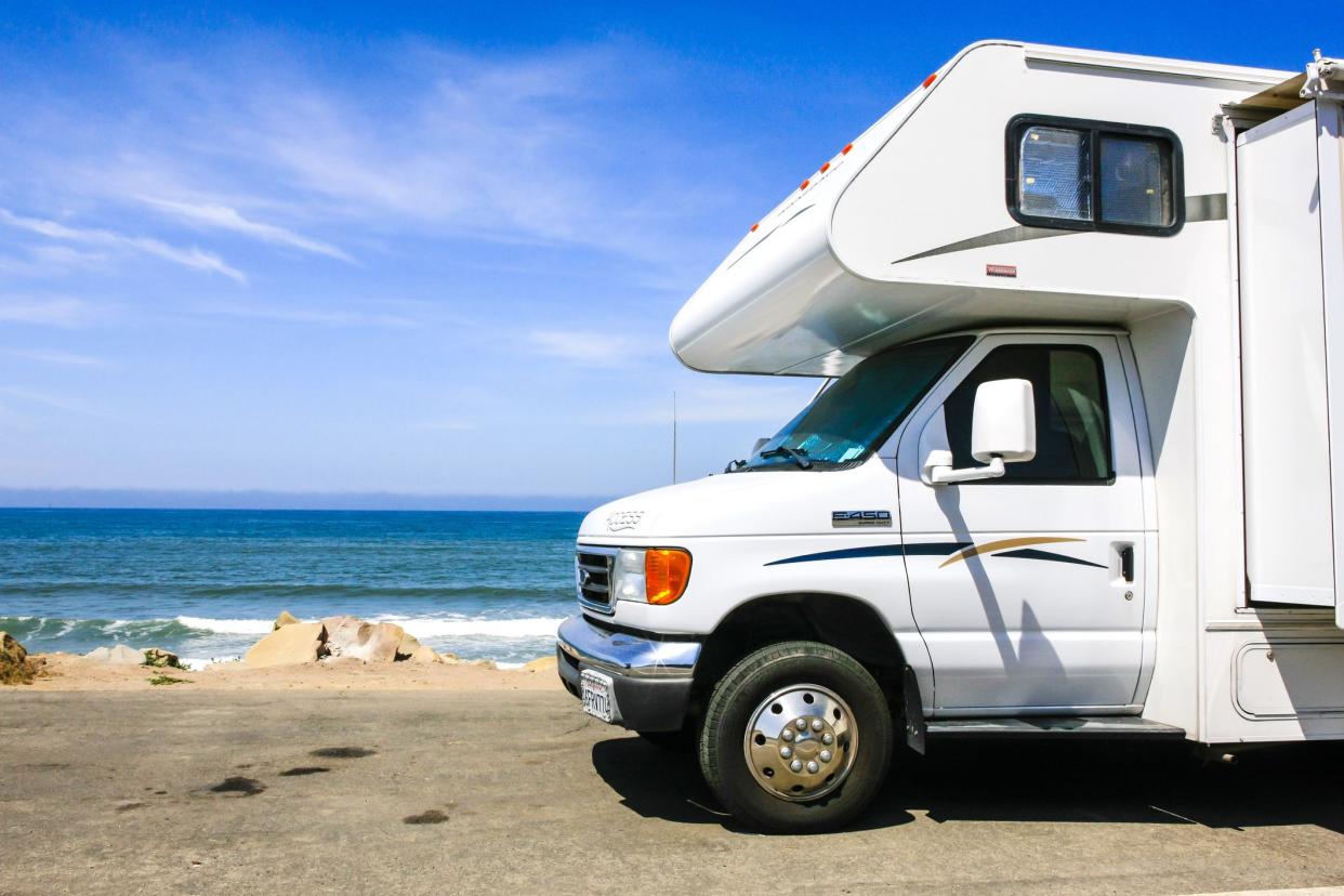Ventura, CA, USA - June 30, 2015: Motorhomes and travel trailers parked up on the edge of PCH - Pacific Coast Highway Rte 1 and the beach just outside Ventura in California