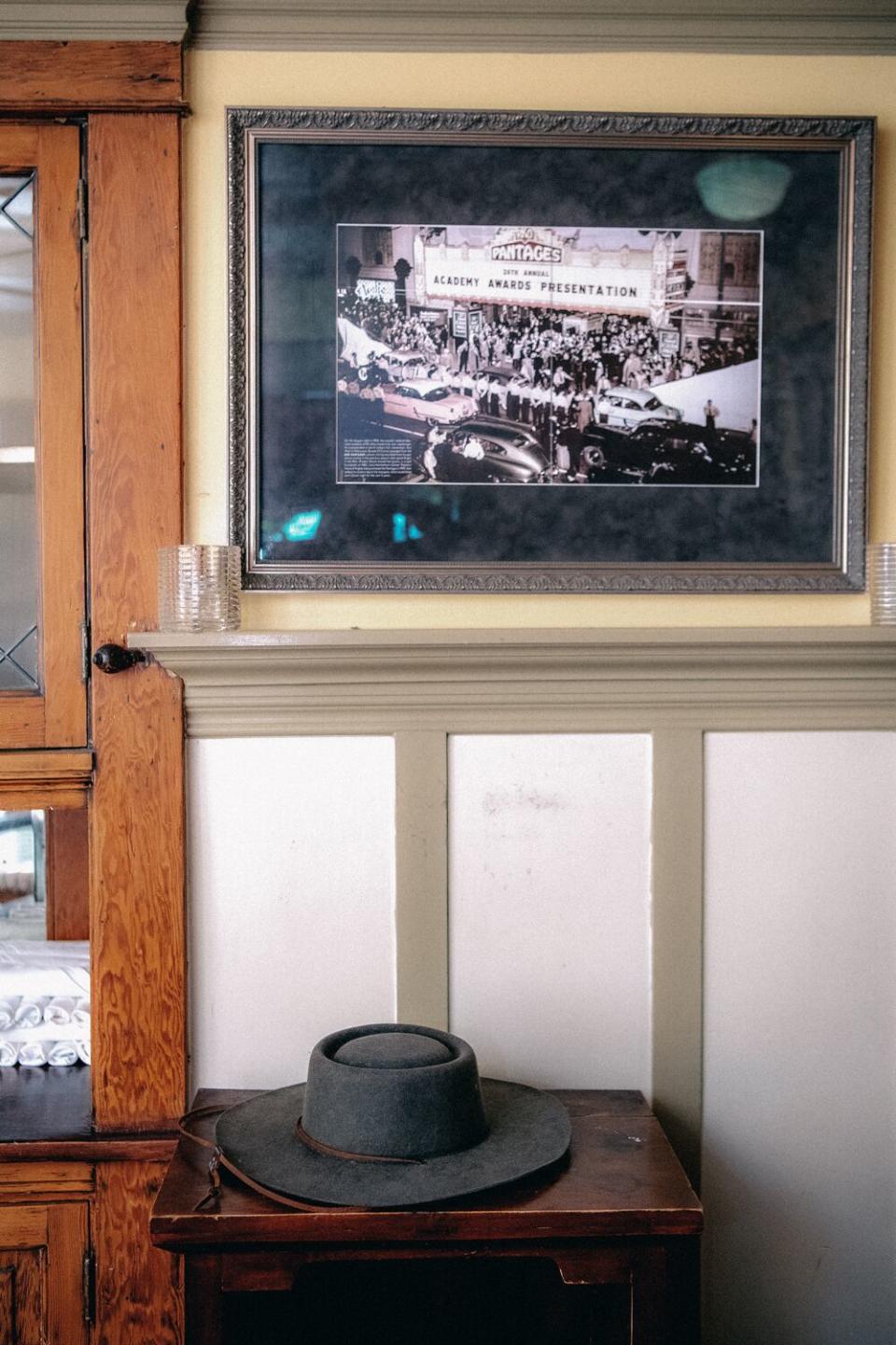 A framed, black-and-white photo of a crowd on a sidewalk at an Academy Awards ceremony.