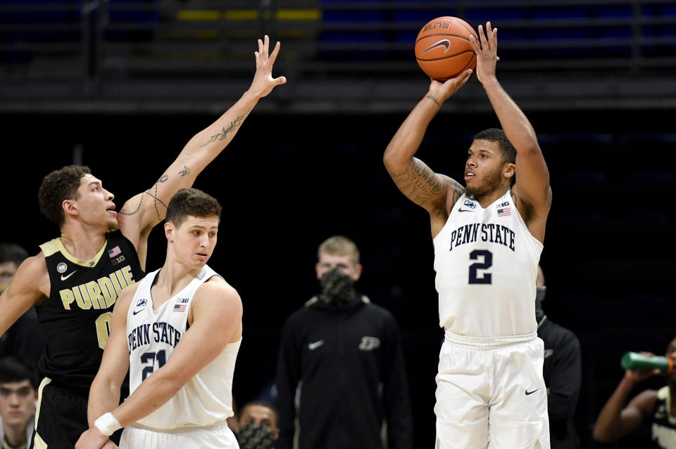 Penn State's Myles Dread shoots a 3-pointer over Purdue's Mason Gillis during an NCAA college basketball game Friday, Feb. 26, 2021, in State College, Pa. (Abby Drey/Centre Daily Times via AP)