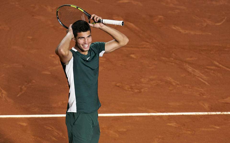 Carlos Alcaraz, pictured here celebrating after beating Stefanos Tsitsipas at the Barcelona Open.