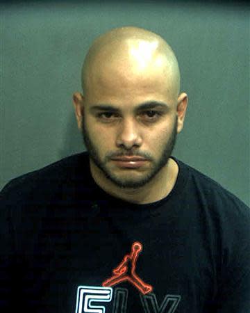 Robert Corchado, 28, is seen in a booking photo from the Orange County Jail in Orlando, Florida taken April 10, 2014. REUTERS/Orange County Jail/Handout