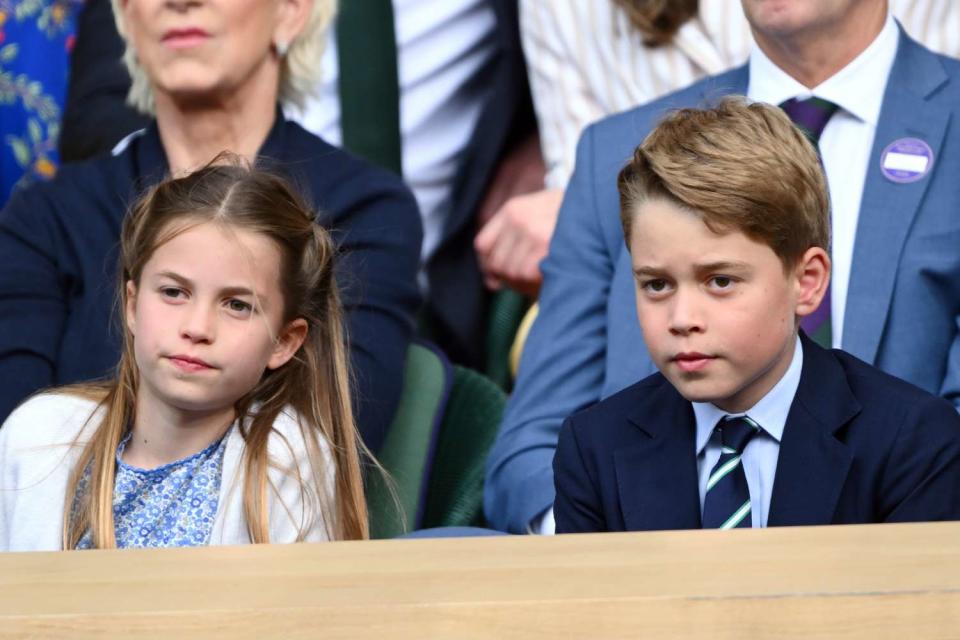 <p>Karwai Tang/WireImage</p> Princess Charlotte and Prince George watch Wimbledon on July 14.