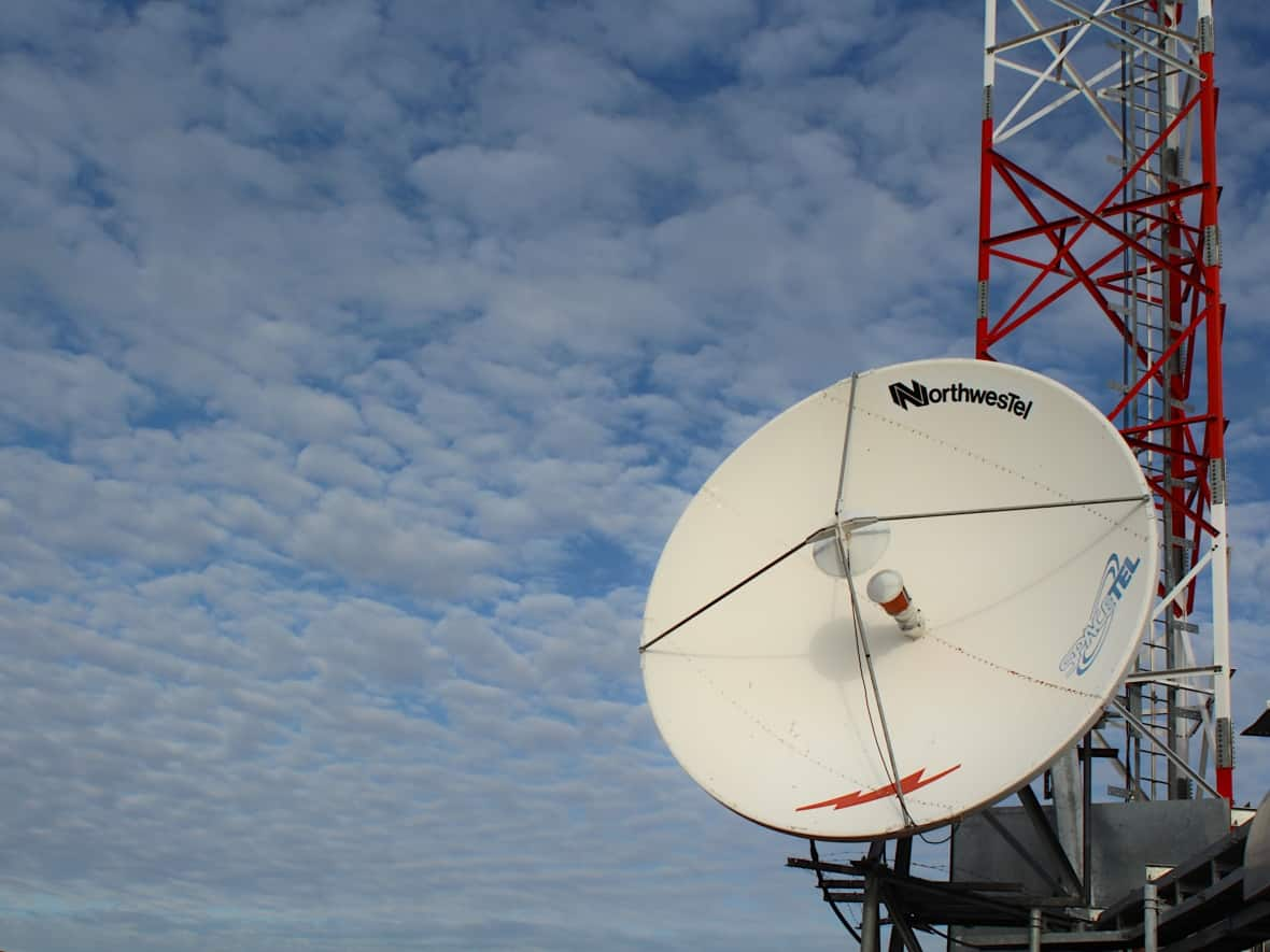 A file image of a Northwestel satellite dish in Kugaaruk, Nunavut, pictured on Sept. 29, 2020. (John Last/CBC - image credit)