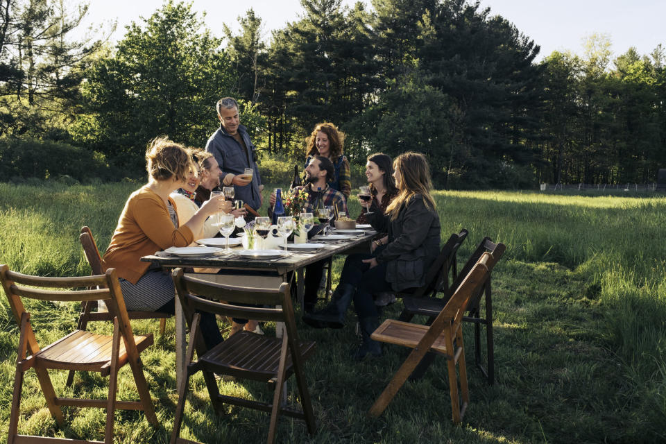 A group of people dining outside.