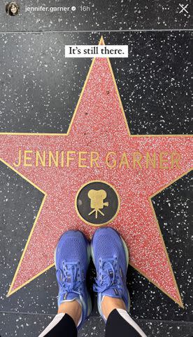 <p>Jennifer Garner/Instagram</p> Jennifer Garner takes a photo on her sneakers on her Hollywood Walk of Fame star