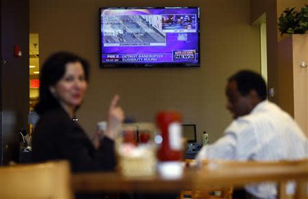 A television screens footage of the bankruptcy hearing in Detroit, Michigan, December 3, 2013. REUTERS/Joshua Lott