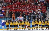 Ice Hockey - Pyeongchang 2018 Winter Olympics - Men's Final Match - Russia - Germany - Gangneung Hockey Centre, Gangneung, South Korea - February 25, 2018 - German team reacts with their silver medals, in front of Russian supporters in the stands. REUTERS/Kim Kyung-Hoon