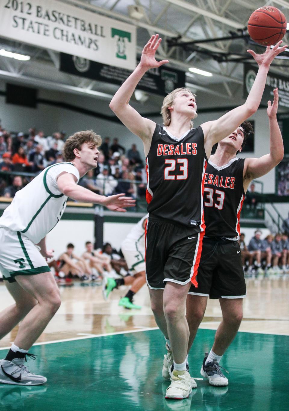 DeSales Crew Gibson grabs a rebound against Trinity at Trinity High School in St. Matthews Tuesday night. Trinity would win 54-49. Nov. 29, 2022