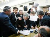 Marek Suski of Law and Justice (PiS) party holds a microphone as the parliamentary Commission on Justice and Human Rights votes on the opposition's amendments to the bill that calls for an overhaul of the Supreme Court in Warsaw, Poland, July 20, 2017. Agencja Gazeta/Adam Stepien/via REUTERS