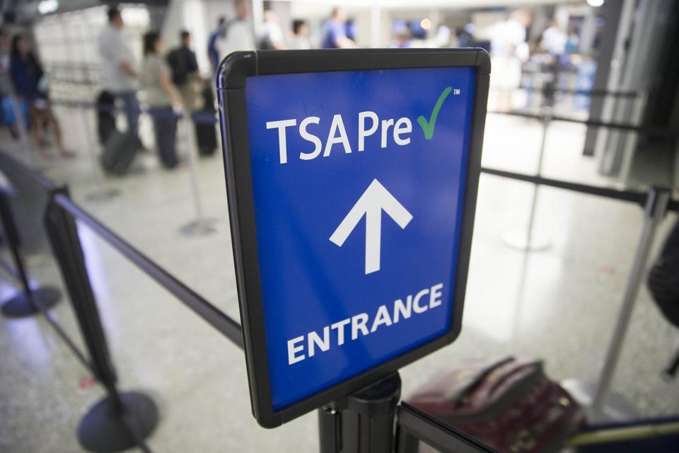 A Transportation Security Administration (TSA) pre-check sign stands at Dulles International Airport
