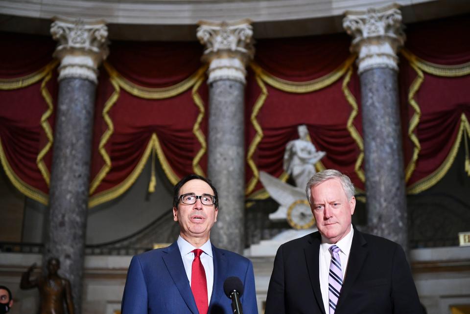 White House Chief of Staff Mark Meadows (R) and US Treasury Secretary Steve Mnuchin speak to the media after meeting with the US Senate Minority Leader and House Speaker on coronavirus relief at the US Capitol in Washington, DC on August 7, 2020. - Democrats urged the White House to stick with negotiations on a new aid plan for Americans facing hardship due to the coronavirus pandemic, after Donald Trump said he is ready to bypass Congress to maintain emergency assistance. (Photo by MANDEL NGAN / AFP) (Photo by MANDEL NGAN/AFP via Getty Images)