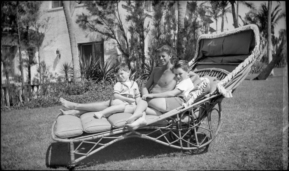 JKF as a young man with his younger brothers Bobby (right) and Teddy at the family's Palm Beach estate.