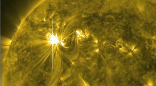 This image obtained from NASA shows one of the largest solar flares of this solar cycle on March 6. The strong geomagnetic storm hit Earth early Thursday, but the planet's magnetic field appeared to be absorbing the shock and it was unlikely to reach severe levels