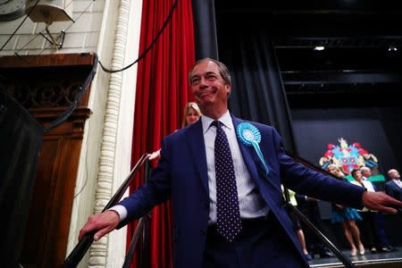 Brexit Party leader Nigel Farage leaves the stage after speaking during the results for the European Parliamentary election in Southampton, Britain, May 27, 2019. REUTERS/Hannah McKay