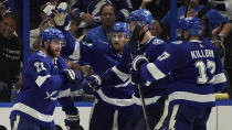 Tampa Bay Lightning center Brayden Point (21) celebrates with teammates after scoring against the New York Islanders during the third period in Game 1 of an NHL hockey Stanley Cup semifinal playoff series Sunday, June 13, 2021, in Tampa, Fla. (AP Photo/Chris O'Meara)