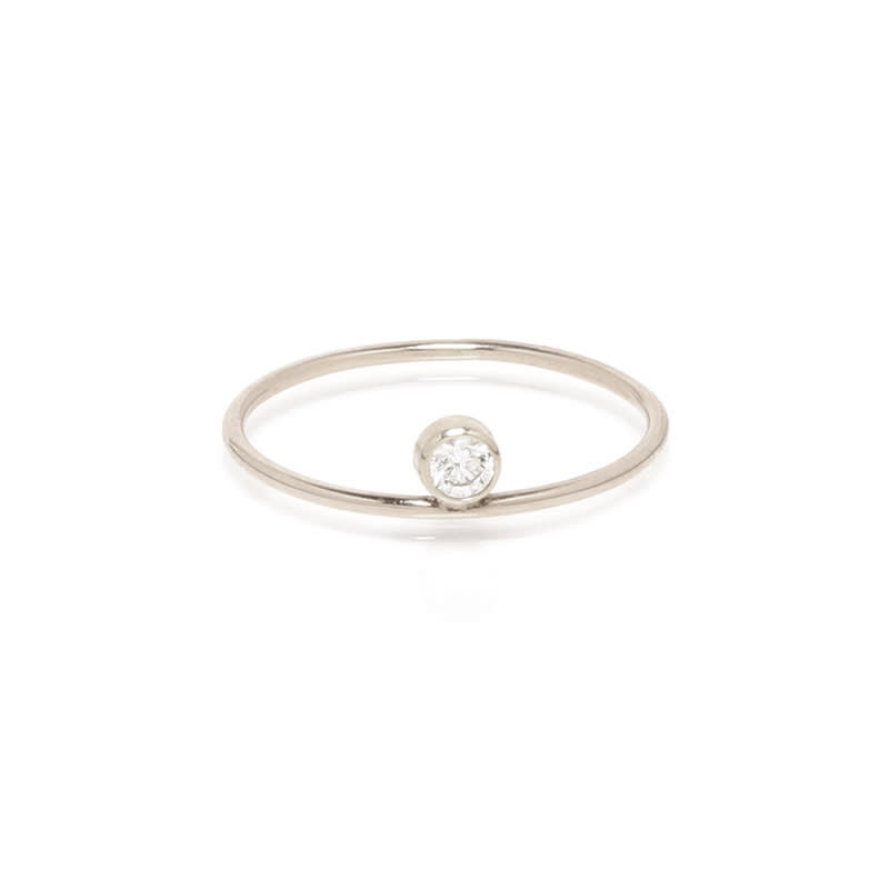 <a rel="nofollow noopener" href="https://zoechicco.com/collections/rings/products/14k-single-bezel-diamond-ring" target="_blank" data-ylk="slk:14k Single Bezel Diamond Ring, Zoe Chicco, $375;elm:context_link;itc:0;sec:content-canvas" class="link ">14k Single Bezel Diamond Ring, Zoe Chicco, $375</a>