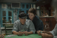 This image released by Netflix shows Ed Harris, left, and Olivia Colman in a scene from "The Lost Daughter." (Yannis Drakoulidis/Netflix via AP)