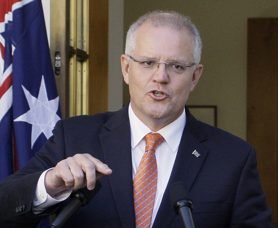 FILE - In this Feb. 13, 2019, file photo, Australian Prime Minister Scott Morrison addresses the media at Parliament House in Canberra, Australia. Morrison was labeled the "Accidental Prime Minister" when he was thrust to the top of a bitterly divided Australian government facing likely defeat in elections only months away. Since he was elected prime minister in a leadership ballot of colleagues in his conservative Liberal Party on Aug. 24, 2018, Morrison has taken as much time as he had available to repair the government and define his leadership before facing the voters. (AP Photos/Rod McGuirk, File)