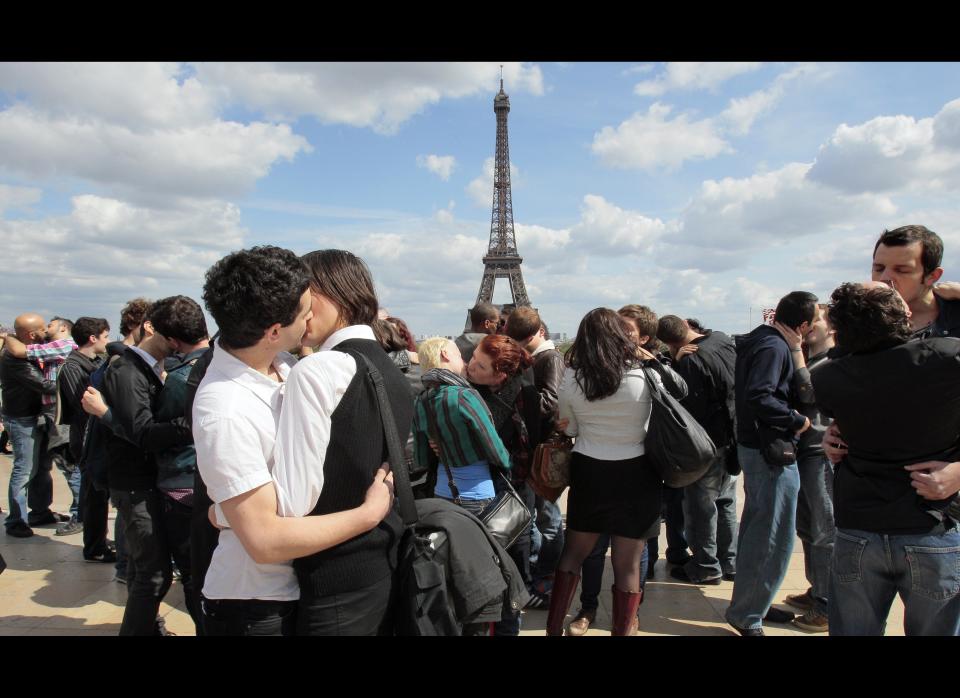 People kiss at the Trocadero, in front of the Eiffel Tower in Paris during a "kiss-in" operation for the world day against homophobia. 