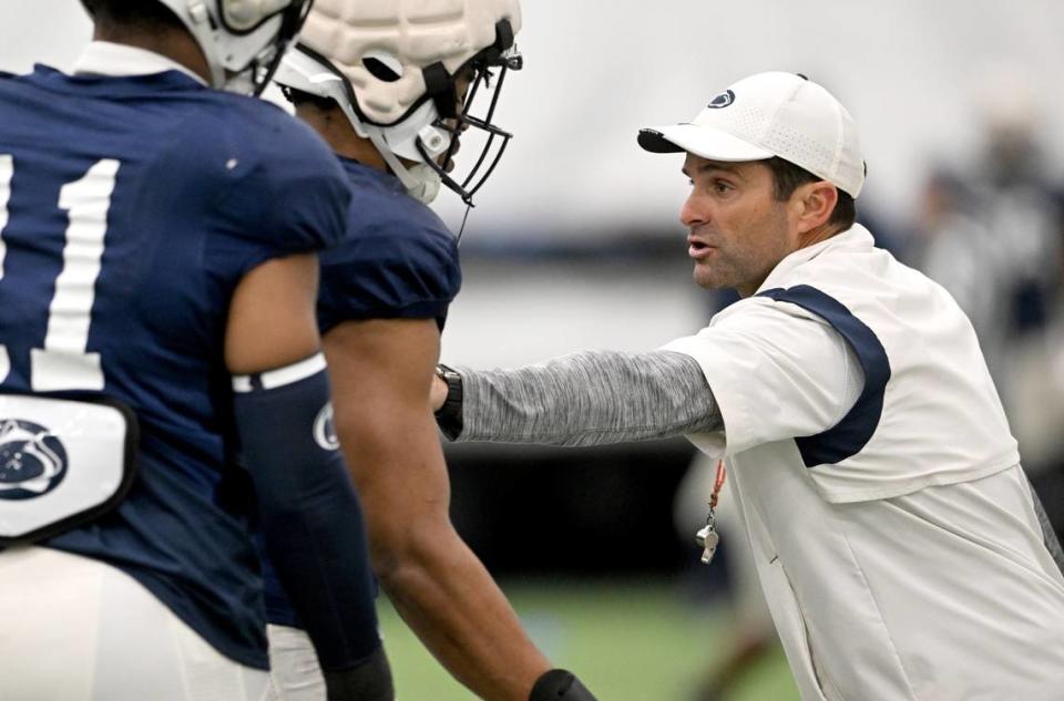 Penn State defensive coordinator Manny Diaz demonstrates a technique during a spring practice on Tuesday, March 28, 2023.