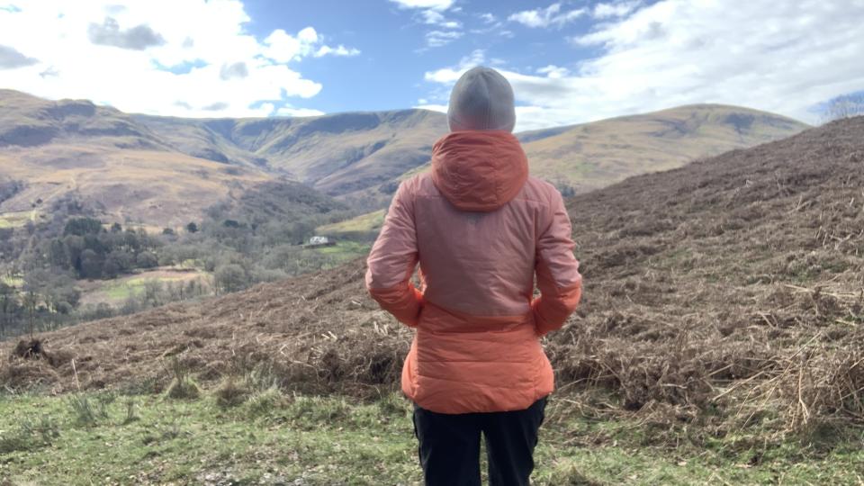 Julia Clarke hiking in the Norrona falketind thermo60 Hood jacket