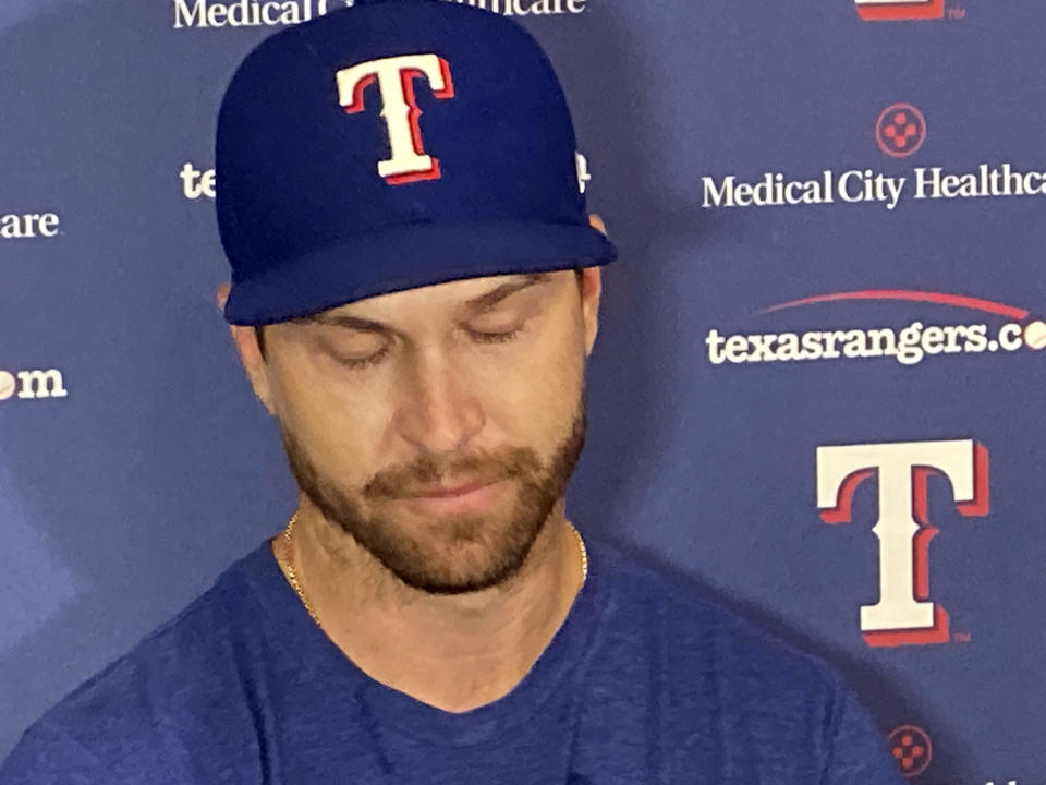 Texas Rangers pitcher Jacob deGrom reacts while speaking to the media during a baseball news conference in Arlington, Texas, Tuesday, June 6, 2023. DeGrom will have season-ending Tommy John surgery, cutting short his first season after the oft-injured right-hander signed a $185 million, five-year contract with the AL West-leading Rangers. (AP Photo/Stephen Hawkins)