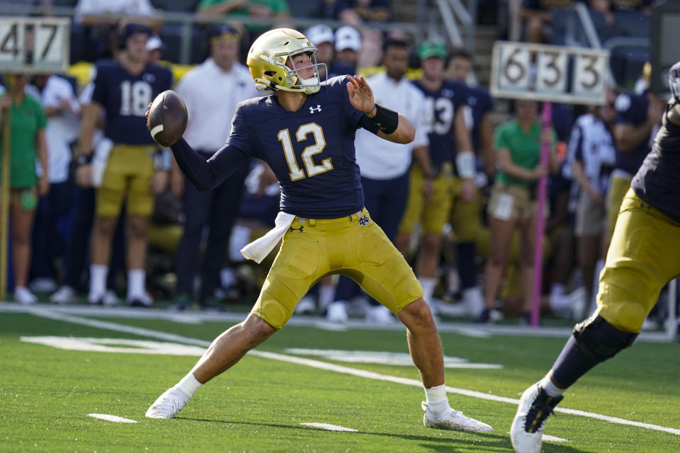 Notre Dame quarterback Tyler Buchner (12) throws against Marshall during the second half of an NCAA college football game in South Bend, Ind., Saturday, Sept. 10, 2022. Marshall defeated Notre Dame 26-21. (AP Photo/Michael Conroy)