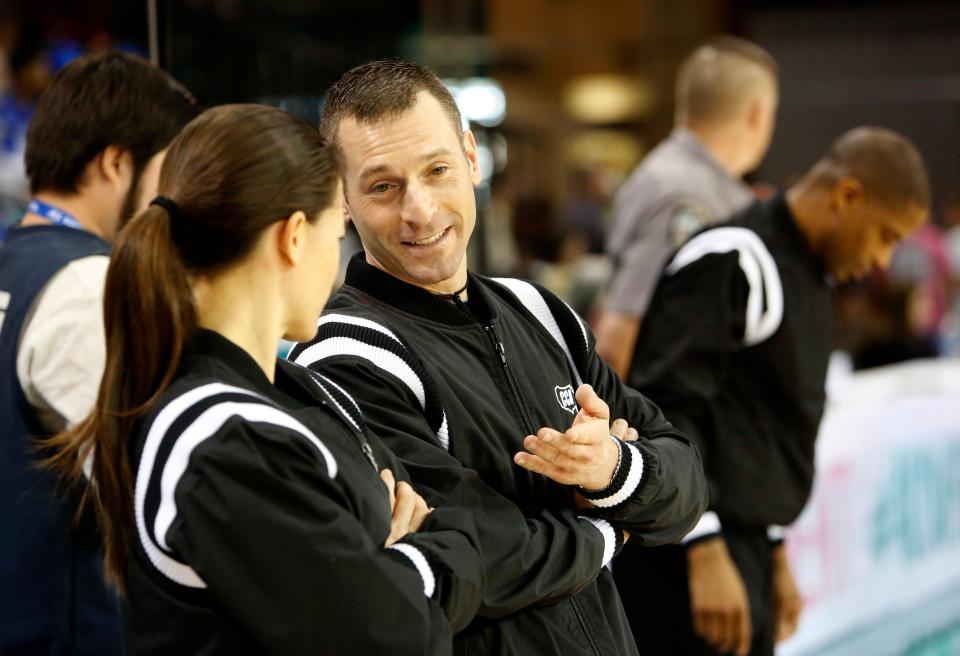 In this Sunday, March 5, 2017, photo, official Joe Vaszily, center talks with official, Maj Forsberg, left, before the start of the women's basketball game between Duke and Notre Dame.