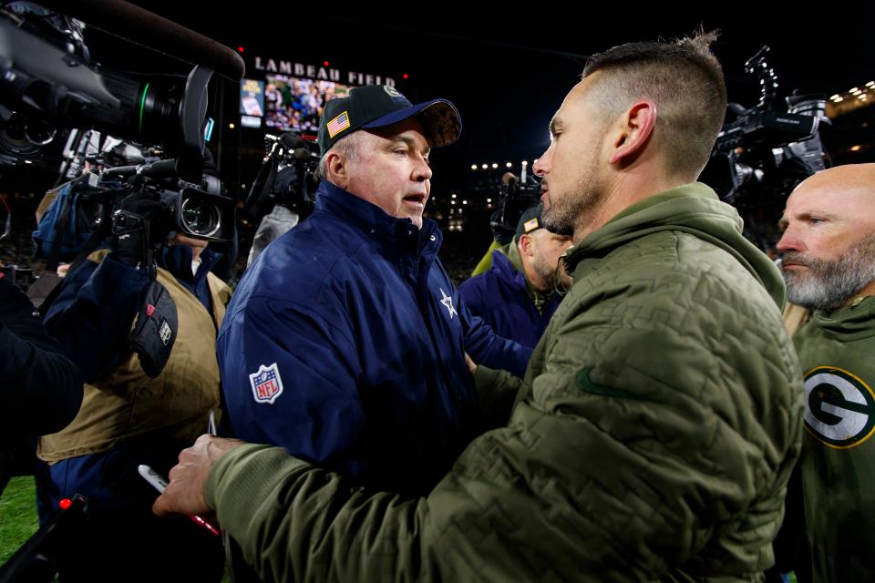 Dallas Cowboys coach Mike McCarthy talks with Green Bay Packers coach Matt LaFleur following their game at Lambeau Field.