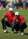 MELBOURNE, AUSTRALIA - NOVEMBER 18: (L-R) Dustin Johnson of the U.S. Team and teammate Tiger Woods line up a putt on the first hole green during the Day Two Four-Ball Matches of the 2011 Presidents Cup at Royal Melbourne Golf Course on November 18, 2011 in Melbourne, Australia. (Photo by Scott Halleran/Getty Images)