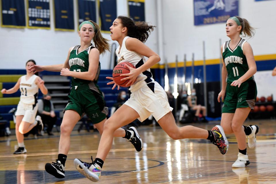 Pequannock's Chloe Vasquez, center, drives to the basket past Hopatcong defenders. Pequannock girls basketball defeated Hopatcong, 69-45, on Monday, February 8, 2021, in Pequannock. 