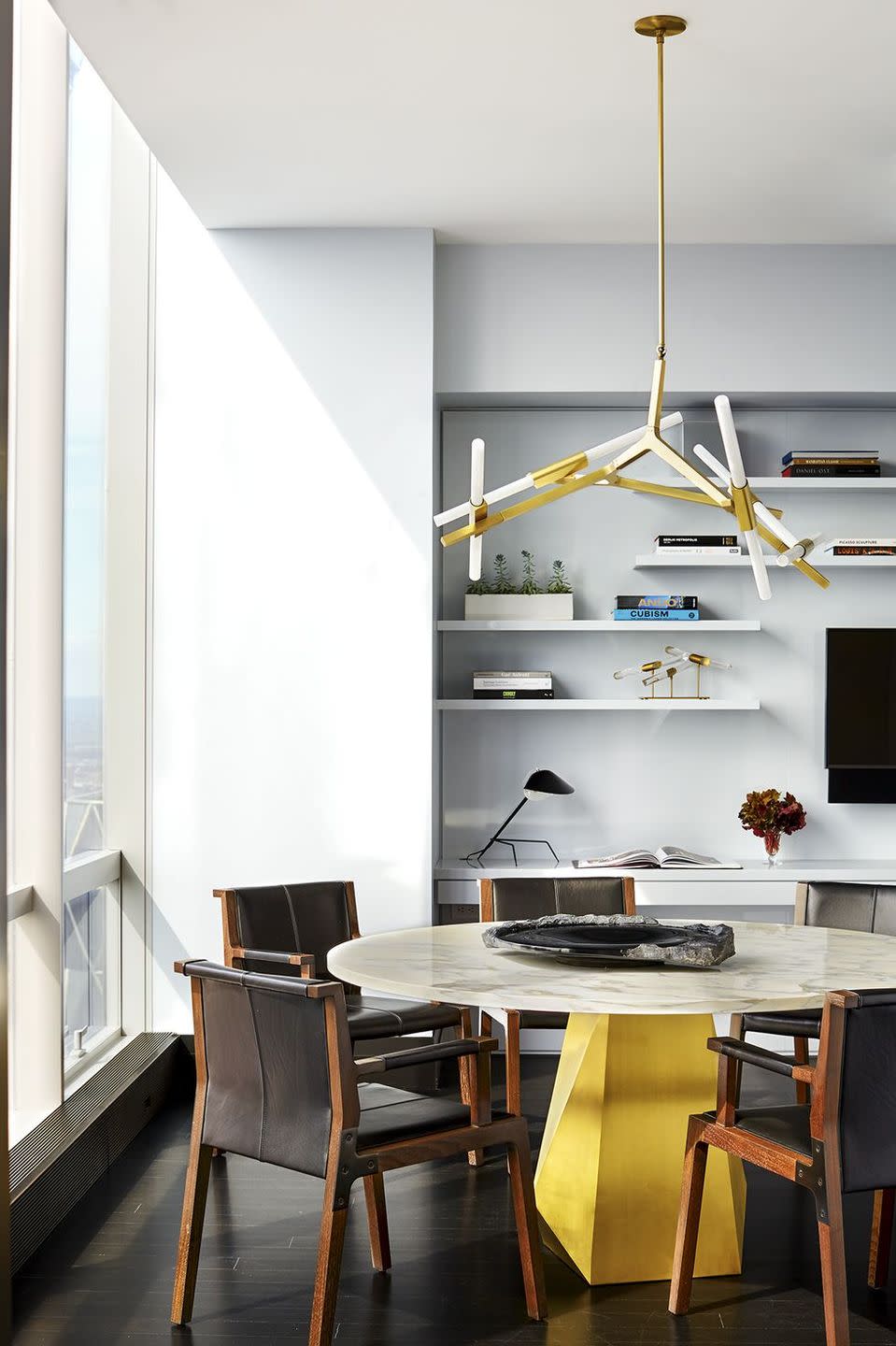 a dining room with a table and chairs