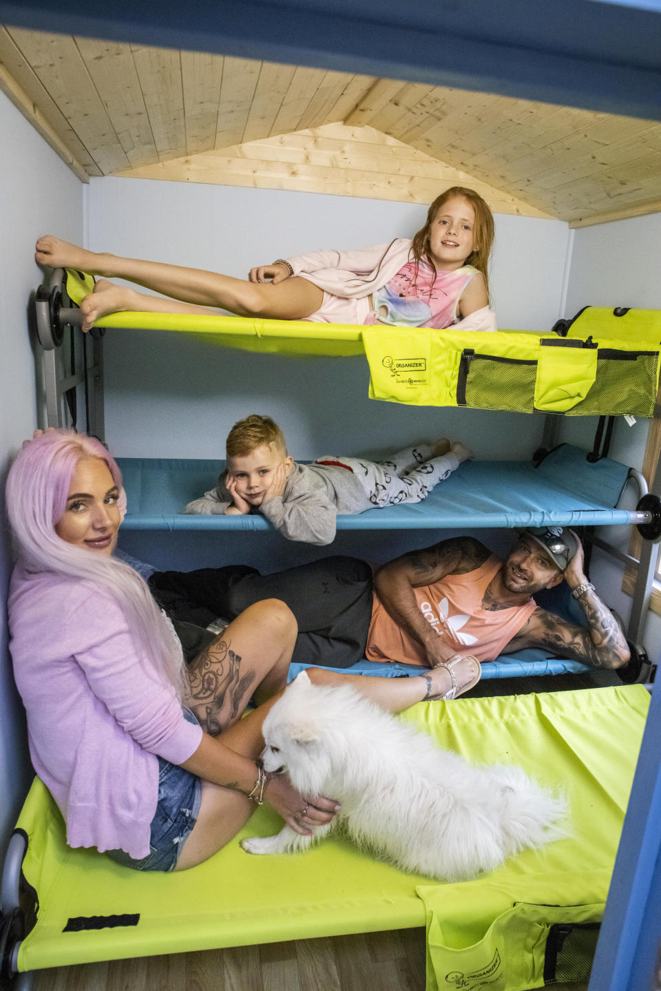 These pictures show a family of four who paid £500 to spent the night in a PLAYHOUSE - that was posted on Airbnb as a joke. Ollie and Kady Hammond had a 'mini break' on Saturday eve in the child's toy house - with their kids Beau, five, and Brooke, ten. They snapped up the booking after it was posted as a prank by Jason Kneen, 49. He built the 8ft (2.4m) by 6ft (1.8m) structure in his garden during lockdown. The dad-of-five then advertised it on the popular travel website for a laugh - but didn't actually think anyone would stump up to stay.