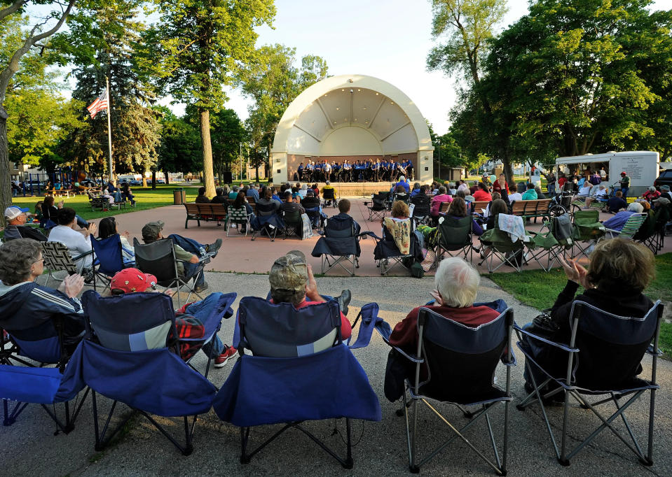 File - Audience members pack Washington Park in Manitowoc for the Manitowoc Marine Band performance July 17, 2014.