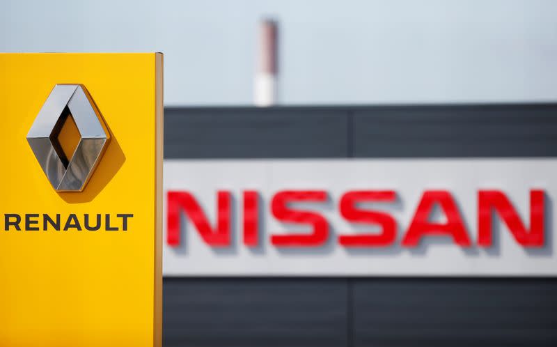 FILE PHOTO: The logos of car manufacturers Renault and Nissan are seen in front of dealerships of the companies in Reims