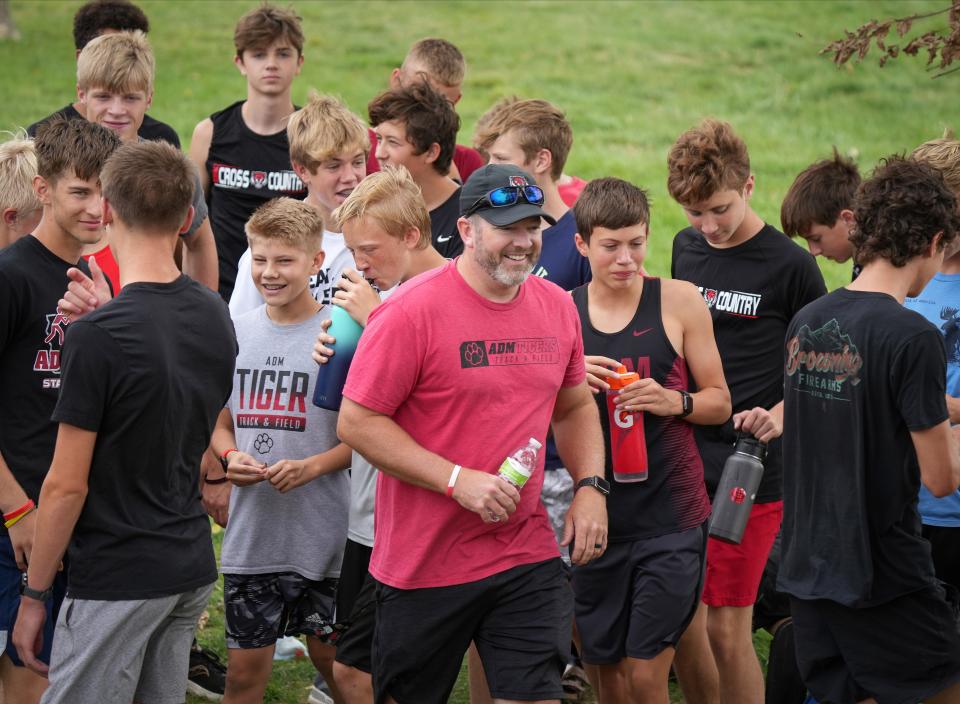 ADM-Adel cross country coach Josh Chapman gets his runners ready for practice on Friday, Sept. 16, 2022.