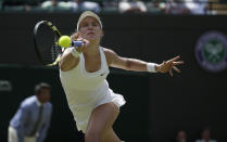 Eugenie Bouchard of Canada hits a return during her women's singles quarter-final tennis match against Angelique Kerber of Germany at the Wimbledon Tennis Championships, July 2, 2014. (REUTERS)