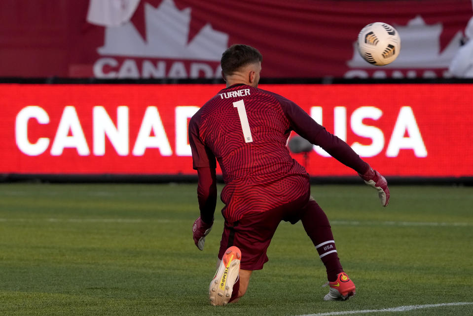 United States' Matt Turner (1) watches the ball fly past to score for Canada's Samuel Adekugbe during the second half of a World Cup soccer qualifier in Hamilton, Ontario, Sunday, Jan. 30, 2022. (Frank Gunn/The Canadian Press via AP)