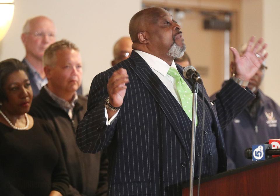 Pastor Lorenzo Glenn of Macedonia Baptist Church speaks at a press conference calling for peace Monday in Founders Hall at Alpha Phi Alpha Homes Inc.