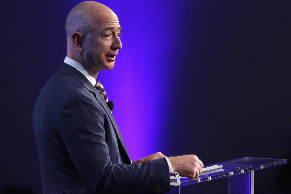 Amazon founder and Washington Post owner Jeff Bezos and U.S. Secretary of State John Kerry deliver remarks during the opening ceremony of the newspaper's new location January 28, 2016 in Washington, DC. Source: Getty