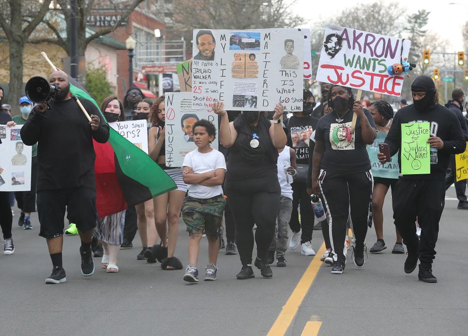 Justice for Jayland Walker protesters march down East Market Street in  Highland Square on Friday.
