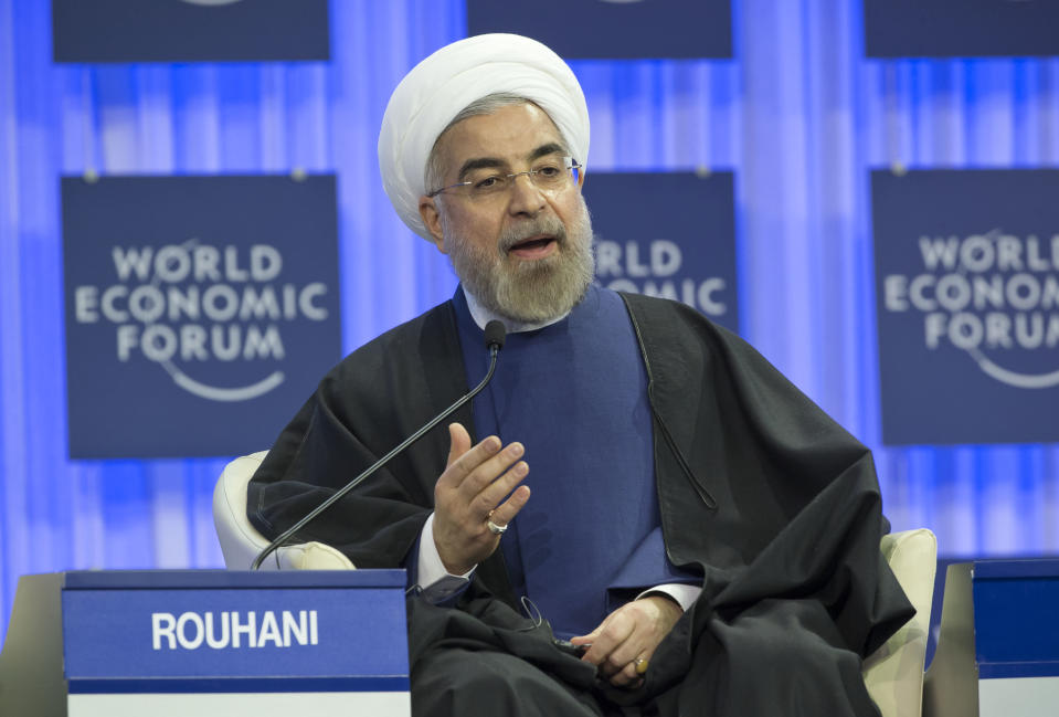 Iranian President Hassan Rouhani, gestures as speaks during a session of the World Economic Forum in Davos, Switzerland, Thursday, Jan. 23, 2014. Leaders gathered in the Swiss ski resort of Davos have made it a top priority to push to reshape the global economy and cut global warming by shifting to cleaner energy sources. (AP Photo/Michel Euler)