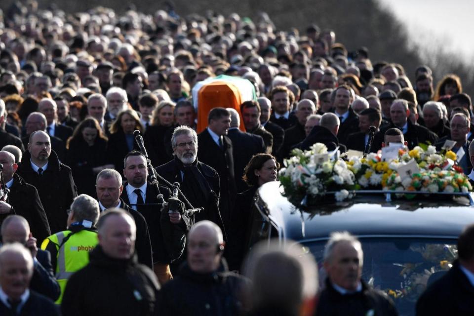 Procession: Sinn Fein President Gerry Adams walks with the funeral cortege leaves St Columba's Church (Getty Images)