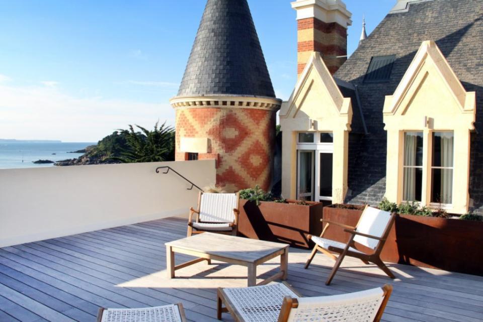 A view of a terrace at Château Le Nessay, on the Emerald Coast of Brittany, France, which is one of the hotels that’s a part of the Small Luxury Hotels Private Collection. Source: Small Luxury Hotels of the World. Small Luxury Hotels of the World