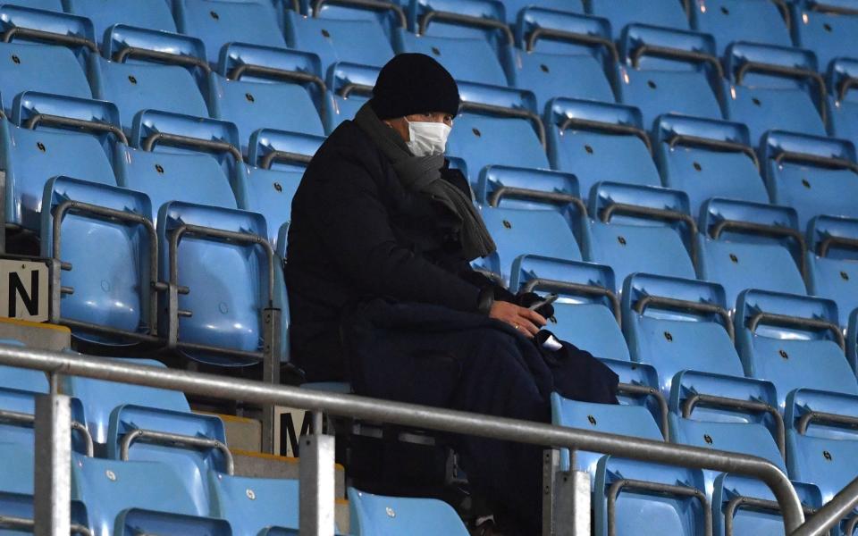 Eddie Jones watches the game from the stands - PA