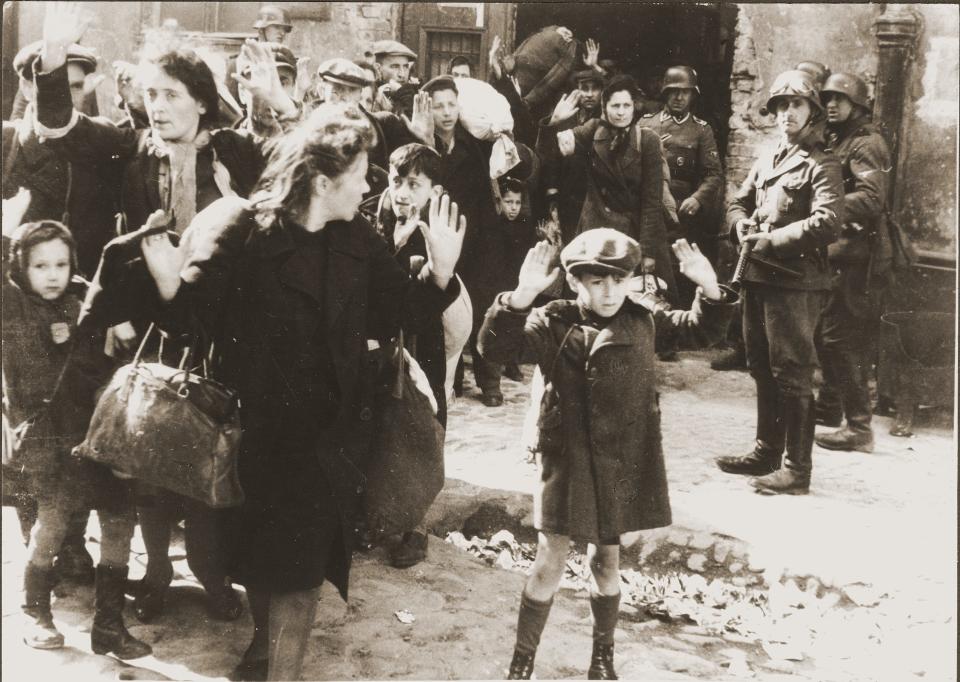 Jewish people captured by SS and SD troops during the suppression of the Warsaw ghetto uprising are forced to leave their shelter and march to the Umschlagplatz for deportation. The photo, which is in the public domain, is part of the April Special Exhibit at Camp Gordon Johnston Museum on Remembering the Holocaust, April 2-29, 2024.